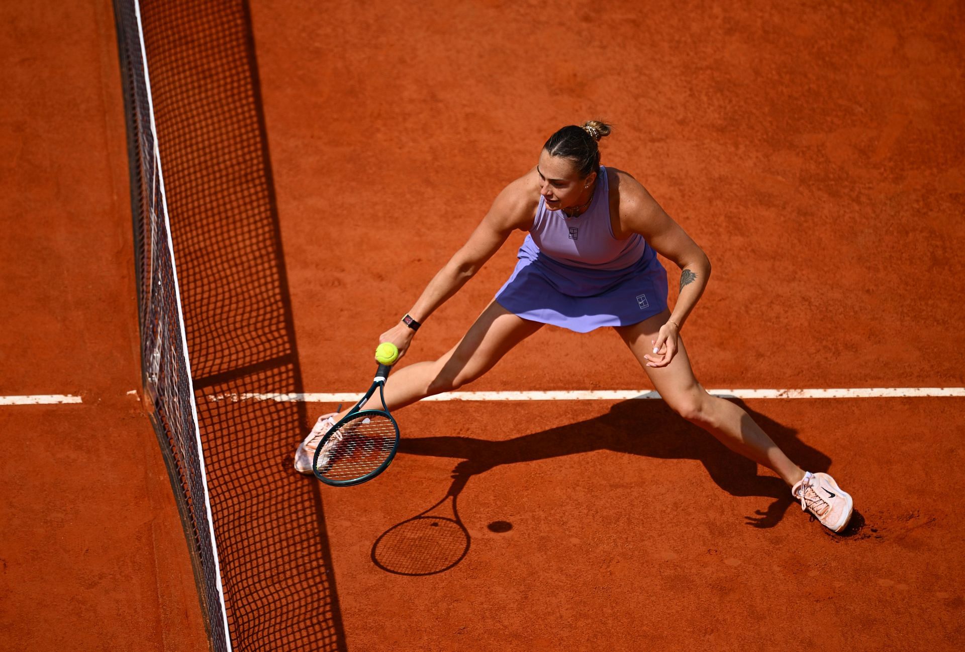 Aryna Sabalenka tracks down a ball during her Italian Open 2R match | Image Source: Getty